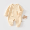 Detail showing soft cotton texture and knot closure of a yellow newborn jumpsuit - 52cm / Yellow (Wing)