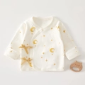 Detail of newborn organic cotton wrap top featuring moon star print and side tie bows - Size 52 (0-1 Month) / Star Moon Pattern (Off-white)