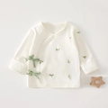 Detail of newborn pure cotton kimono top with green leaf print and silk ribbon ties - Size 52 (0-1 Month) / Sprouts Pattern (Off-white)