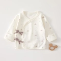Close-up of cotton newborn kimono wrap top with blue dots and purple bow ties - Size 52 (0-1 Month) / Flower Pattern (Off-white)