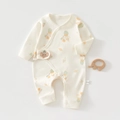 Detail of newborn organic cotton romper featuring colorful hot air balloon prints and labels - 66 / Cute Elephant Planet