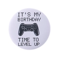 White birthday badge featuring retro gaming pixel art and black gamepad icon - Birthday Time To Level Up (MXZ126)