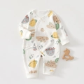 Detail van katoenen babyromper met sterrenprint en handige striksluiting opzij - Gelukkige Planeet / 52cm