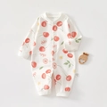 Close-up of cotton baby romper with cherry prints, snap buttons, and size tag - 59 / Red Cherry