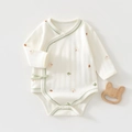 Close-up of baby long sleeve bodysuit with autumn leaf print and soft ribbed cotton texture - Autumn Pumpkin