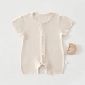 Close-up of beige baby short sleeve bodysuit with snap button closure and side wash label - Beige