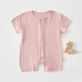 Detailed view of pink infant short sleeve bodysuit with snaps and size label 59/44 - Deep Pink