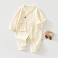 Detail of baby organic cotton romper with vertical ribbed texture and crown logo - 52cm / Crown Yellow