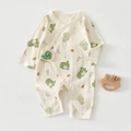 Detail of newborn long-sleeve cotton romper featuring a cute green dinosaur print and snaps - 52 / Green Dinosaur