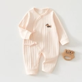 Detail of peach pink cotton newborn romper with dog embroidery and ribbon tie - Dachshund Pink