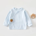 Macro shot of light blue newborn cotton kimono top with cute woven flower detail - 52cm / Petal Blue