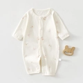 Close-up of the cherry and bow print on this soft cotton baby long sleeve romper suit - Size 59 / Cherry Bow Style
