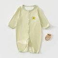 Close-up of soft green baby romper with yellow smile print and convenient snap buttons - Green / Size 66