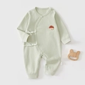 Detailed view of soft ribbed cotton baby bodysuit with embroidery and side tie closure - 52cm / Pale Green