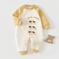 Detailed view of quilted cotton baby romper with Three Puppy print and snap buttons - 59 / Yellow Dog