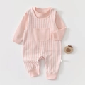 Close-up of pink and white checkered baby jumpsuit with soft cotton fabric texture - Gingham Pink