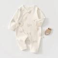 Close-up of baby romper showing side-snap design with bunny and floral patterns - 52cm / Cream Rabbit