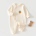 Close-up of baby romper with strawberry embroidery and soft ribbed cotton fabric texture - Milky White (Carrot) / Size 66