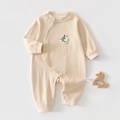 Close-up of baby romper showing cotton rib fabric, snap buttons and fish embroidery - Apricot (Dove) / Size 66