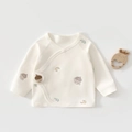 Close-up of soft organic cotton newborn baby shirt with cute hand-drawn forest prints - Pine Cone Moon / 52cm