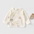 Detailed macro view of cream cotton newborn wrap top with traditional kite print patterns - 52 / Green Kite