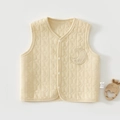 Detail of baby quilted vest featuring star embossed texture and Baby moon patch - 66 / Milk Yellow
