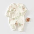 Detailed view of cream newborn cotton romper with rabbit print and side tie closure - 52 / Green Leaf Rabbit
