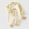 Close-up of winter baby romper featuring soft herringbone texture and animal embroidery - Green Field Dragon Baby