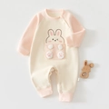 Detail of baby winter onesie showing rabbit embroidery and snap buttons on waffle fabric - Pink Misty Sweet Rabbit