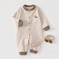 Detail of newborn thermal cashmere silk bodysuit with striped pattern and puppy embroidery - Size 66 / Top And Bottom / Striped Coffee