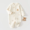 Close-up of ribbed cotton baby romper with bear embroidery and snap button closure - Blue Bear Print