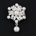 Elegant silver snowflake brooch with pearls and crystals on a black textured background - White Pearl Silver Tone (C006-A)