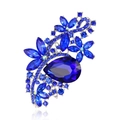 Elegant silver brooch with blue rhinestones and large pear-cut gem in flower design - White K Royal Blue