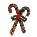 Macro shot of vintage gold Christmas brooch featuring crossed candy canes with red and green rhinestones - Retro Gold Crossed Candy Cane Style (C226-A)
