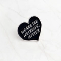 Heart-shaped black enamel brooch with WE ARE THE WEIRDOS MISTER text and silver trim - Heart Letter Style (xz1023)