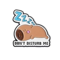 Cute sleeping Capybara enamel pin with Don't Disturb Me slogan and Zzz blue text detail - Sleeping Capybara (QHXZ3664)