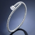 Close-up of silver-tone stainless steel beaded bangle with unique nail head closure. - Beaded Nail Style (32-D-7) / Steel