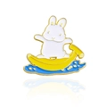 Cartoon white bunny surfing on a yellow banana in blue waves enamel pin with gold plating - Rabbit Banana Skateboard Style (CC354)