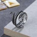 Vintage snake shaped titanium steel ring with detailed scales in a retro silver finish - US 7 / Steel with Black Eye