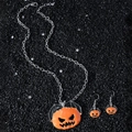 Σετ κοσμημάτων Halloween με κολοκύθα και νυχτερίδα σε μαύρο πέτρινο φόντο - Κολιέ και σκουλαρίκια