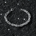 Men's 6mm stainless steel box chain bracelet with lobster clasp on a textured dark background - Silver Paperclip Chain Bracelet