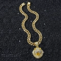 Iced out gold hip hop necklace featuring a Cuban link chain and a lion head pendant - Lion Head Full Rhinestone Necklace / Gold