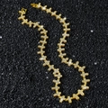 Collana hip hop dorata con maglie a croce e cristalli pavé su sfondo di pietra nera - Oro-Collana (45cm)
