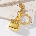 Goldener Schlüsselanhänger aus Zinklegierung in Handtaschenform mit Karabinerhaken - Gold