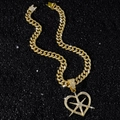 Goudkleurige hiphop Cubaanse ketting met een opengewerkte hart- en sterhanger - Kettingset / Goud (Hol Hart) - Met Ketting