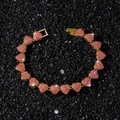 Pink heart-shaped link bracelet with sparkling rhinestones on black stone background - 8.5inch / Gold