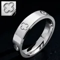 Elegant silver stainless steel ring featuring zircon inlays and unique clover engraving - Size 7 / Four-Leaf Clover Style / Steel