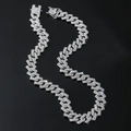 Macro detail of silver hip hop Cuban link chain with dense rhinestone pavé on dark surface - 18 inch Necklace / Silver