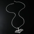 Gothic silver bat pendant necklace with black and white crystals on black mirror surface - Bat Pendant (Silver-Stainless Steel Rope Chain) / Silver