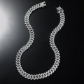 Close-up of silver Cuban link necklace featuring iced-out pavé crystals on black background - Necklace / Silver / 20inch